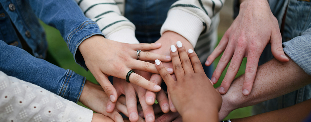 Closeofofhandsincirclebygetty-images-1020x400.png