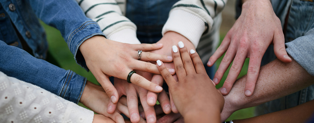 Closeofofhandsincirclebygetty-images-1020x400copy.png